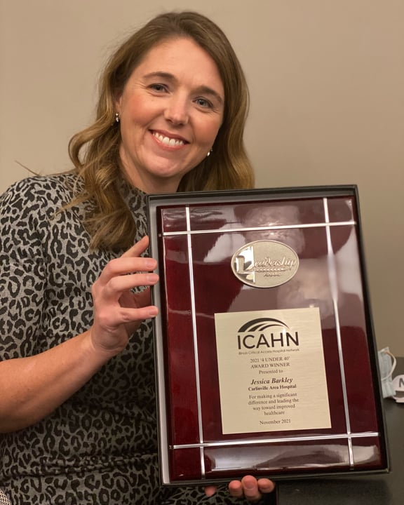 Photo of Jessica Barkley with her exemplary leadership award